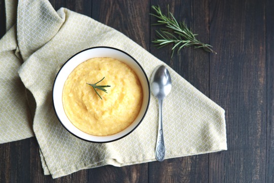 creamy polenta with fresh herbs and parmesan cheese